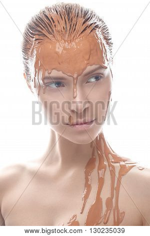 Beautiful girl with a creative clay makeup. Beauty face