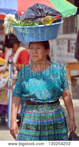 QUETZALTENANGO GUATEMALA april 28 2016 : Woman carring fruits in Quetzaltenango maket. This native market is the most colorful in Central America