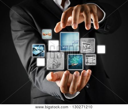 Man with preview digital business photos on virtual screen, concept of modern technology