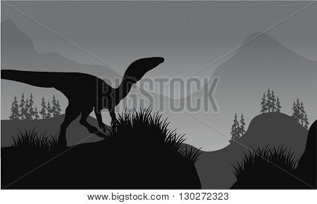 Silhouette of one eoraptor in hills with gray backgrounds