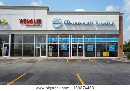 JOLIET, ILLINOIS / UNITED STATES - AUGUST 16, 2015: One may eat Chinese food at Weng Lee Chinese Kitchen, and have one's clothes cleaned at CD One Price Cleaners, in a Joliet strip mall.