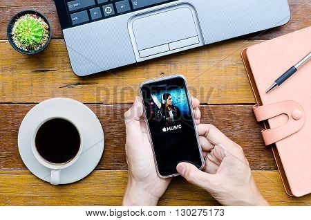 CHIANG MAITHAILAND - FEB 072016 : Man holding a iPhone 6s with apple music application.Apple Music is the new iTunes-based music streaming service that arrived on iPhone.