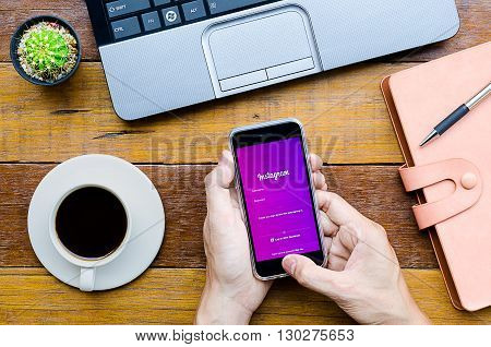 CHIANG MAITHAILAND - FEB 072016 : Man holding a iPhone 6s with Instagram application.Instagram is largest and most popular photograph social networking site in the world.