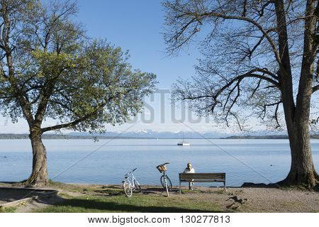 An image of a woman having a rest at Starnberg lake