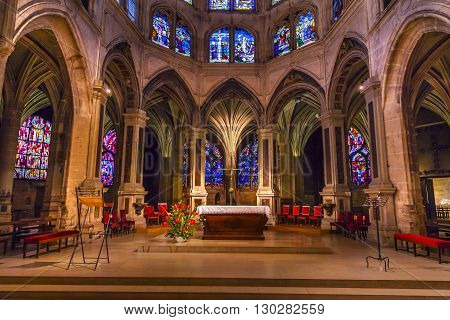 PARIS, FRANCE - MAY 31, 2015 Altar Cross Column Shape of Palm Tree Stained Glass Saint Severin Church Paris France. Saint Severin one of oldest churches Paris located in the Latin Quarter. Built in the 1500s