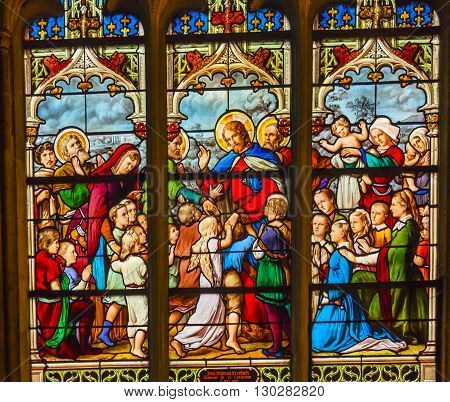 PARIS, FRANCE - MAY 31, 2015 Jesus Christ Children Suffer the Little children to come to me Stained Glass Saint Severin Church Paris France. Saint Severin one of oldest churches Paris located in the Latin Quarter. Built in the 1500s