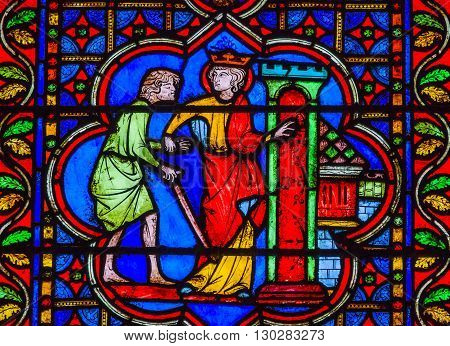 PARIS, FRANCE - MAY 31, 2015 King Sword Castle Medieval Stories Stained Glass Notre Dame Cathedral Paris France. Notre Dame was built between 1163 and 1250AD.