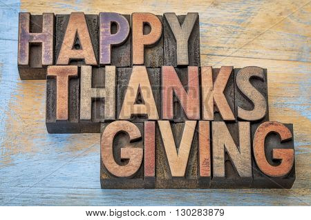 Happy Thanksgiving - a greeting card or banner in vintage letterpress wood type blocks