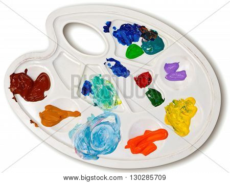 White artist palette with acrylic paint samples.
