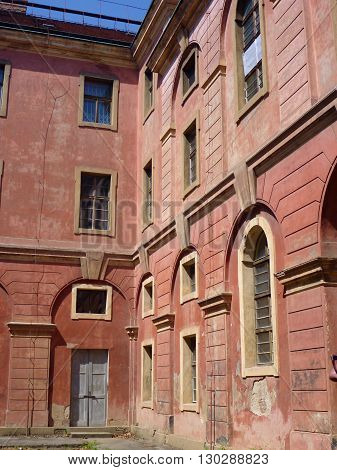 Weathered Building Of Invalidovna In Prague