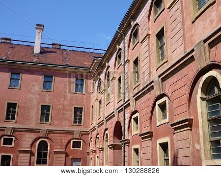 Weathered Building Of Invalidovna In Prague