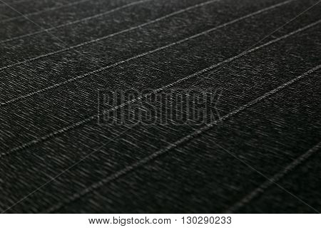 Abstract textured minimalist dark background with diagonal lines. The texture.