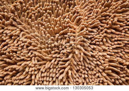 orange cleaning doormat or carpet texture background