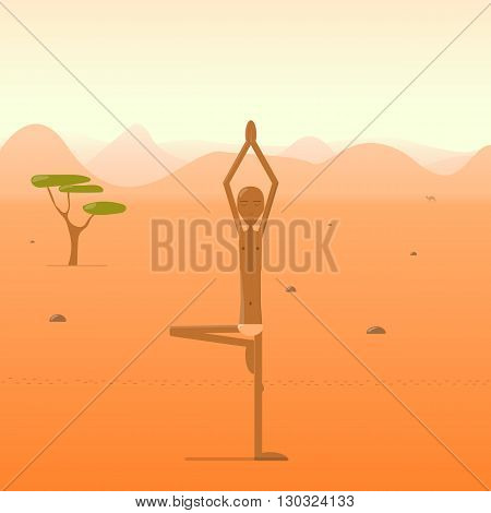 Yogi standing in the tree pose in the desert.