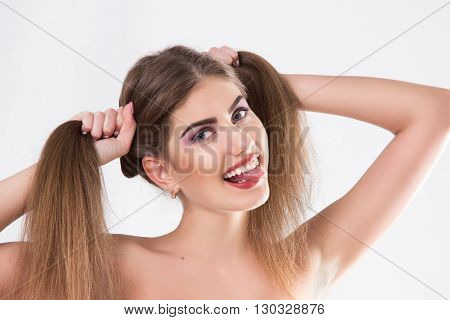 young woman with the put-out uvula. a horizontal portrait on a white background