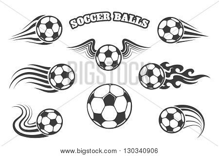 Footballs or soccer balls with wings fire and various motion trails. Isolated on white.
