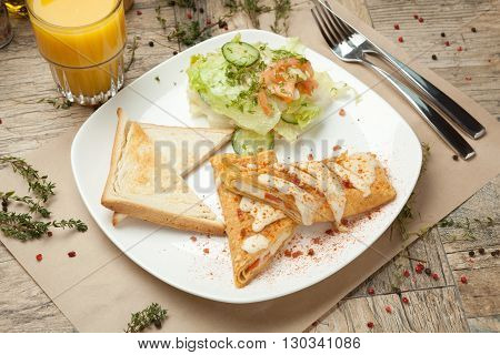 Skrembl Sprinkled With Crispy Bacon Crumbs And Salad Mix Of Salads.