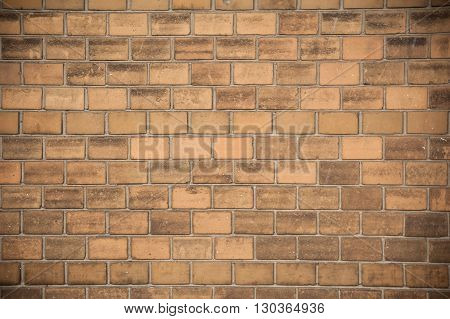 Texture of old weathered yellow brick wall