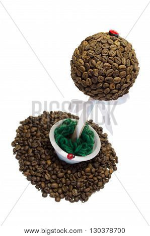 coffee tree on a white background and spilling grain