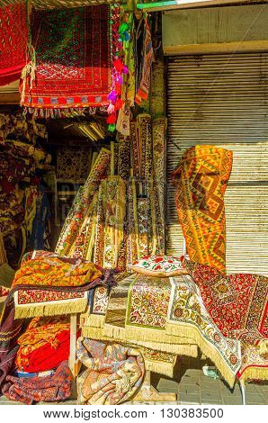 The colorful patterned silk rugs in the flea market stall of old Jaffa Tel Aviv Israel.