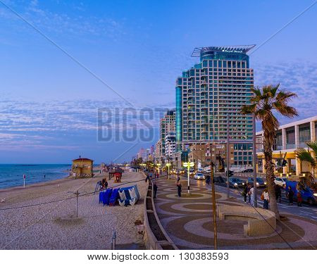 TEL AVIV ISRAEL - FEBBRUARY 25 2016: The twilight over Aviv beach and the central city promenade on February 25 in Tel Aviv.