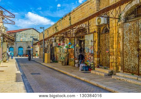 TEL AVIV ISRAEL - February 25 2016: The lamps shop in the flea market neighborhood of Jaffa offers the colorful chandeliers and lamps for each taste on February 25 in Tel Aviv.