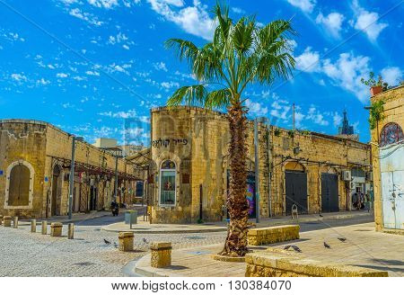 TEL AVIV ISRAEL - February 25 2016: The old stone buildings of former warehouses nowadays serve as shops and art galleries on February 25 in Tel Aviv.