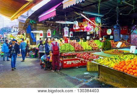 TEL AVIV ISRAEL - FEBBRUARY 25 2016: The different fruits in Carmel market stall attract the clients on February 25 in Tel Aviv.