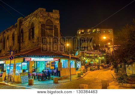 TEL AVIV ISRAEL - FEBBRUARY 25 2016: The cafe in the old Jaffa in the evening lights on February 25 in Tel Aviv.