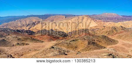 The red yellow brown and grey slopes of Eilat mountains Israel.