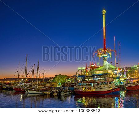 EILAT ISRAEL - FEBRUARY 24 2016: The amusement park becomes one of the brightest noisiest and colorful places in the evening on February 24 in Eilat.