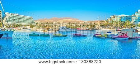 EILAT ISRAEL - FEBRUARY 23 2016: Panorama of marina with a lot of tiny colorfull tourist boats on February 23 in Eilat.