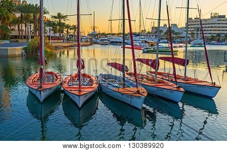 EILAT ISRAEL - FEBRUARY 23 2016: The small sailing yachts are dancing on the waves in Lagoona on February 23 in Eilat.