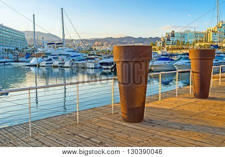 EILAT ISRAEL - FEBRUARY 23 2016: The promenade of Lagoona decorated with the large flower pots on February 23 in Eilat.