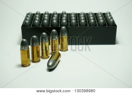 9mm bullets wit box isolated on white background