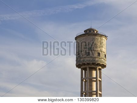 Old Water tower against the blue sky