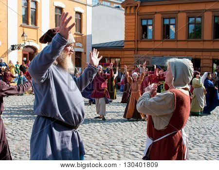 TURKU FINLAND 30 JUNE: The Medieval Market of Turku is historical reenactment event and includes a handicrafts market with participants garbed in period costumes on june 30 2013 in Turku Finland.