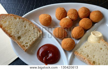 Breaded mozzarella cheese balls. Arancine. Italian food.