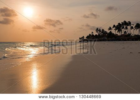 Manchebo beach on Aruba island at sunset in the Caribbean