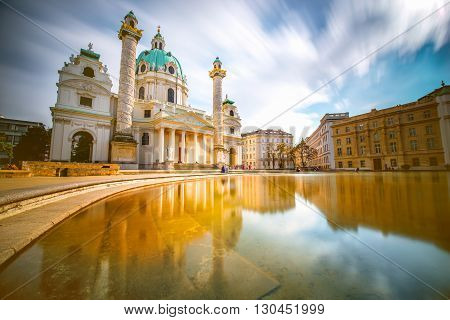 View on st. Charles's church on Karlsplatz in Vienna. Long exposure technic with blurred clouds and glossy water