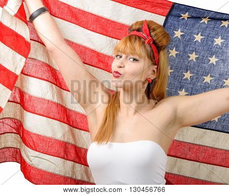 a sexy pin up girl holding an American flag.
