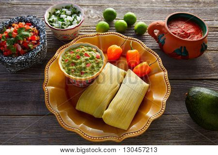 Mexican Tamale tamales of corn leaves with chili and sauces