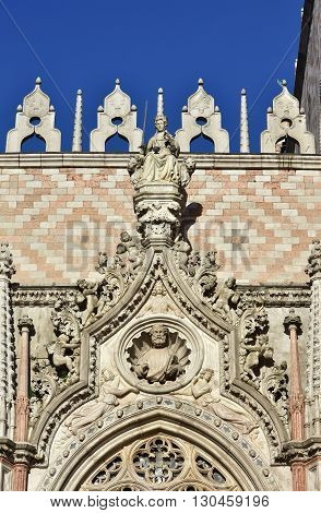 Beautiful gothic portal in Sain Mark Square with Goddess of Justice at the top
