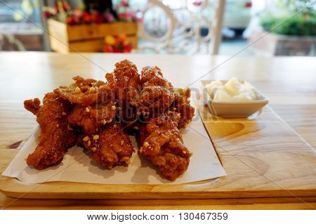 Korean teaste chicken fried serve with pickled vegetables
