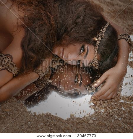 Attractive young tribal woman in ethnic jewelry