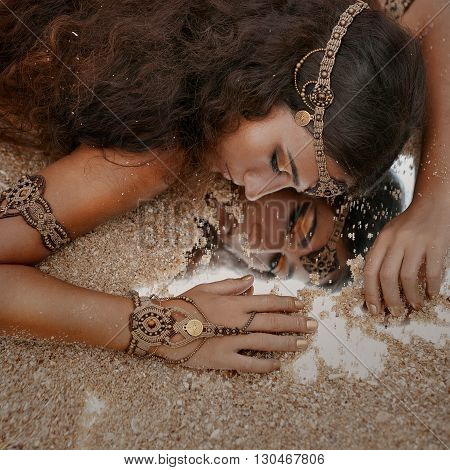 Attractive young tribal woman in ethnic jewelry