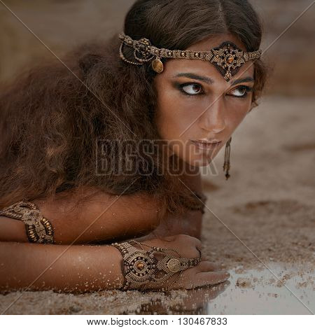 Attractive young tribal woman in ethnic jewelry