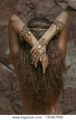 Attractive young tribal woman in ethnic jewelry