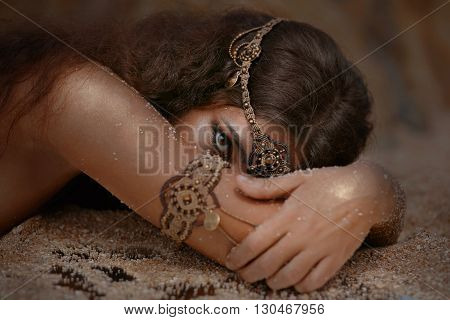 Attractive young tribal woman in ethnic jewelry