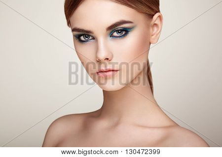 Beautiful woman face. Perfect makeup. Beauty fashion. Eyelashes. Lips. Cosmetic Eyeshadow. Perfect skin